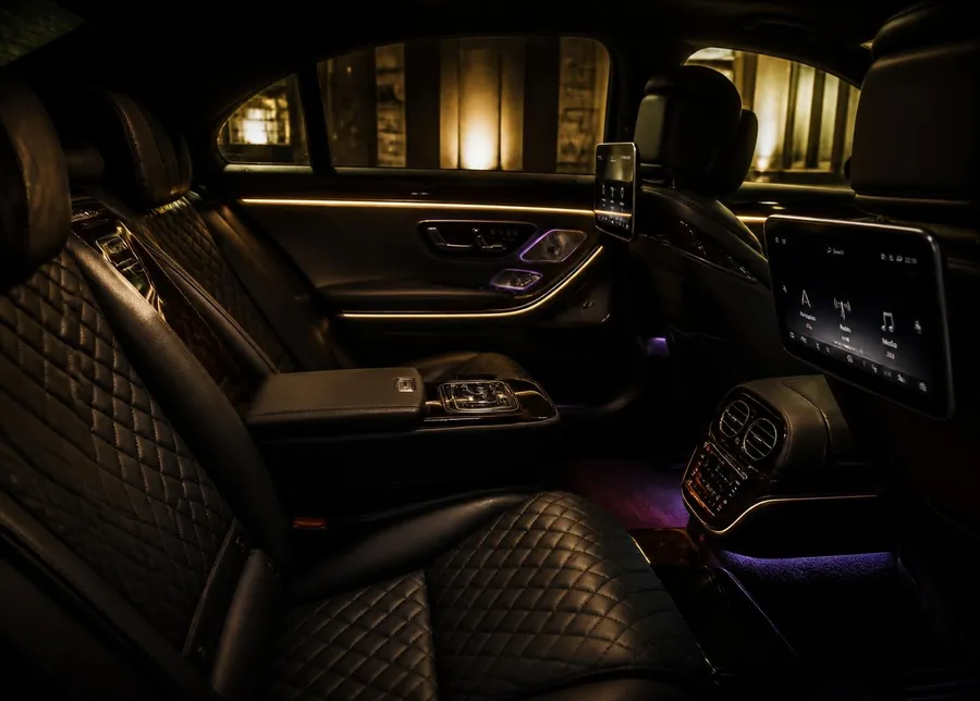 Rear cabin of a premium executive sedan with quilted leather seats